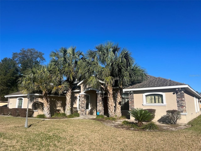 view of front of home with a front yard