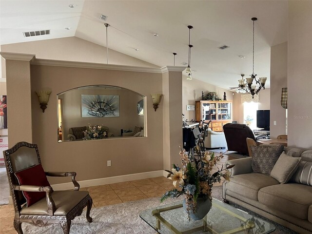 tiled living room featuring ornamental molding, an inviting chandelier, and lofted ceiling