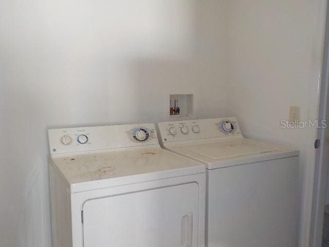 laundry room featuring washing machine and dryer