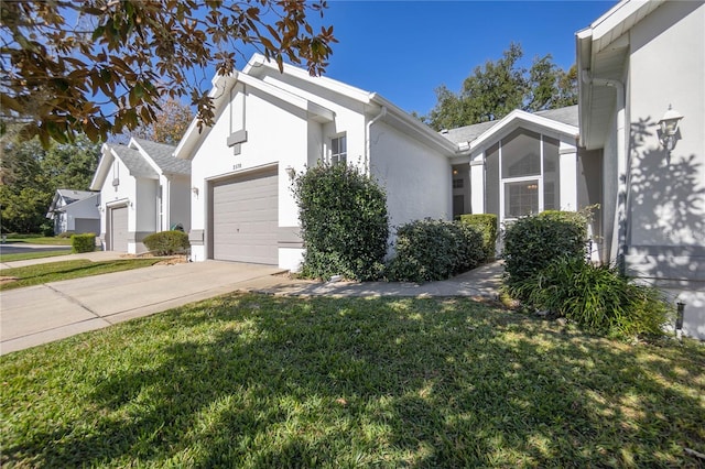 view of home's exterior with a yard and a garage