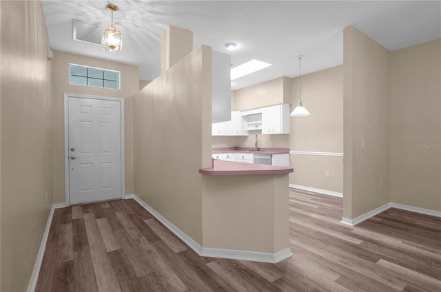 foyer entrance featuring hardwood / wood-style floors and sink