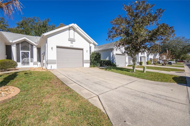 single story home with a front lawn and a garage