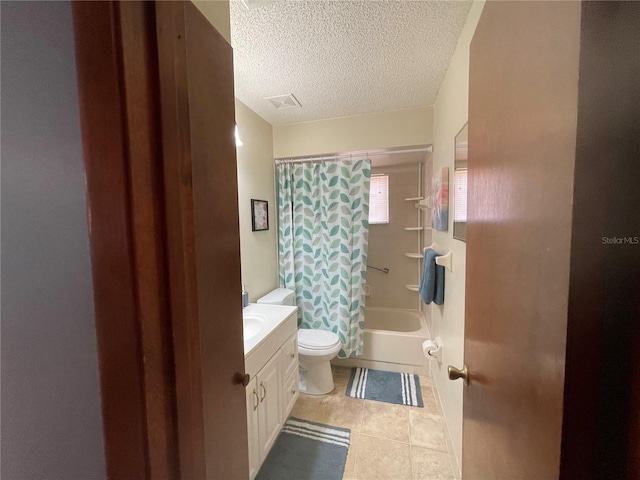 full bathroom with vanity, tile patterned floors, toilet, shower / bathtub combination with curtain, and a textured ceiling