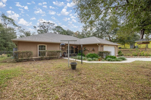 ranch-style home with a front yard and a garage