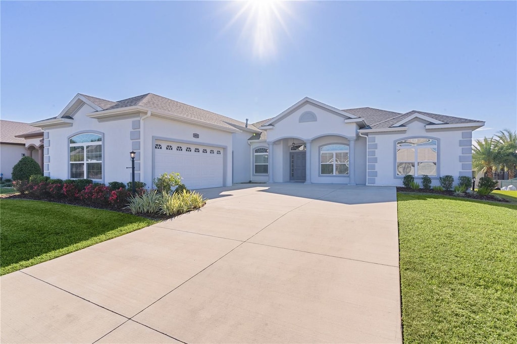 ranch-style house with a front lawn and a garage