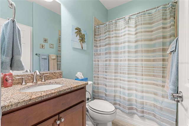 full bathroom with vanity, toilet, and shower / bath combo with shower curtain