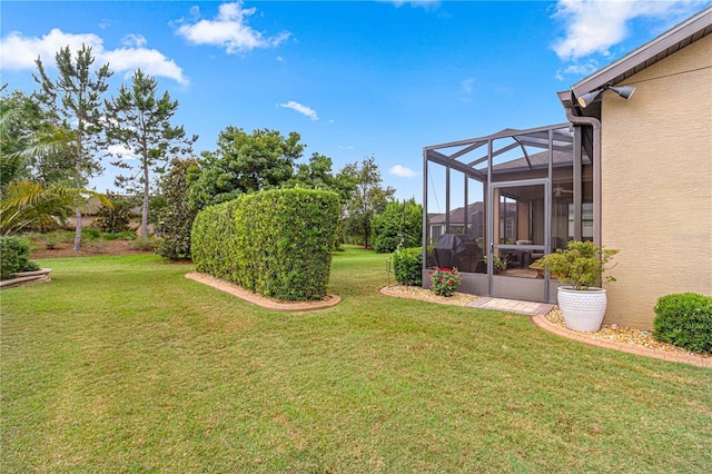 view of yard featuring a lanai