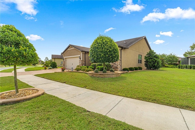 view of front of home with a front yard and a garage