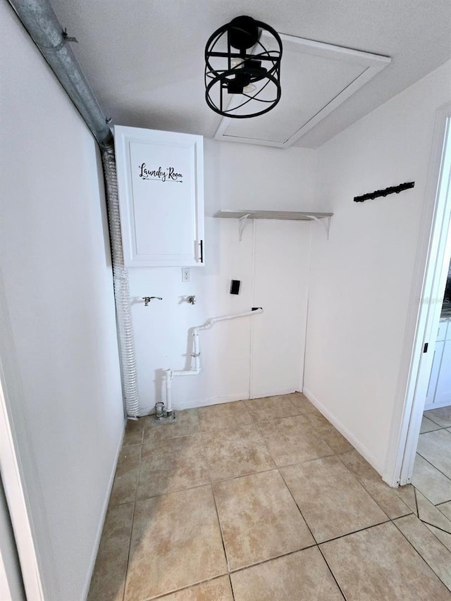 laundry area featuring light tile patterned flooring