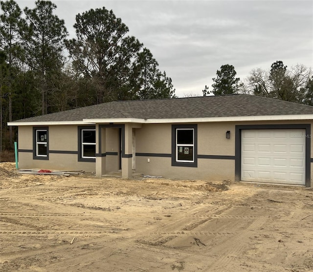 single story home featuring a garage