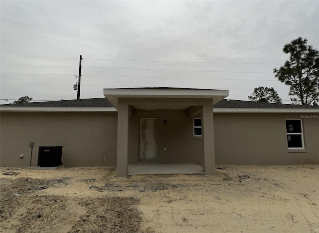 back of house with a patio and central air condition unit