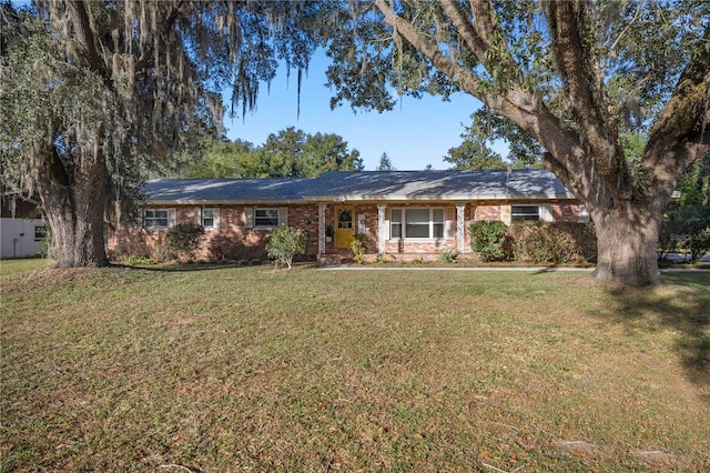 ranch-style home with a front lawn