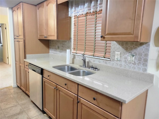 kitchen featuring sink, light stone counters, decorative backsplash, stainless steel dishwasher, and light brown cabinets