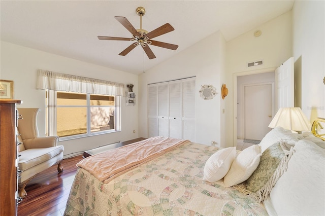 bedroom with a closet, vaulted ceiling, ceiling fan, and dark wood-type flooring