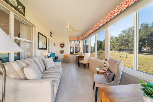 sunroom / solarium with ceiling fan