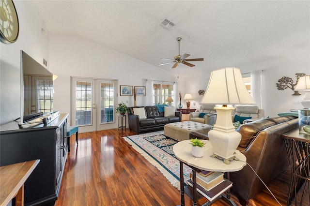 living room with french doors, dark hardwood / wood-style floors, vaulted ceiling, and ceiling fan