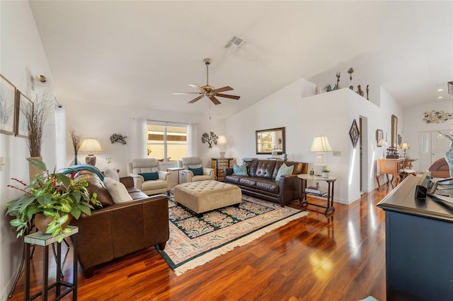 living room with ceiling fan, dark wood-type flooring, and vaulted ceiling