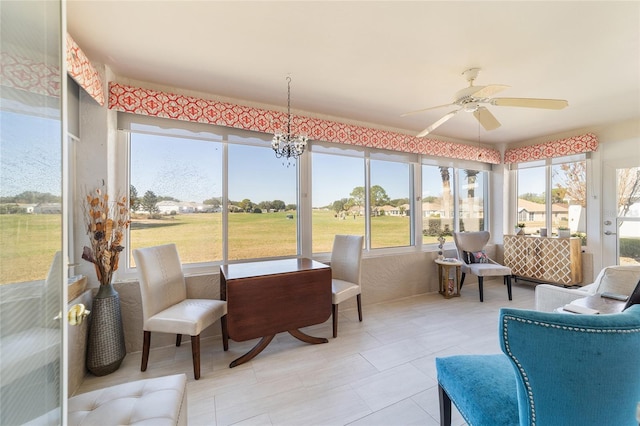 sunroom / solarium with a wealth of natural light and ceiling fan