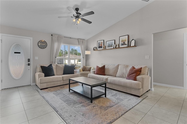 tiled living room featuring ceiling fan and vaulted ceiling