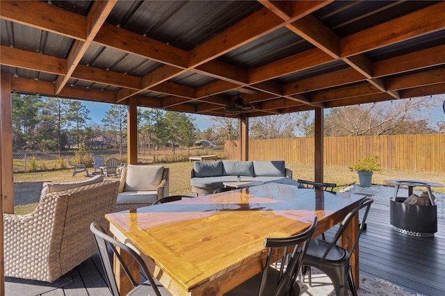 exterior space featuring ceiling fan and a deck