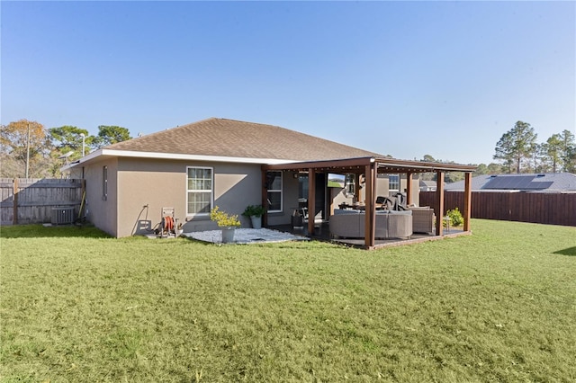 back of property with a patio area, an outdoor living space, a yard, and cooling unit