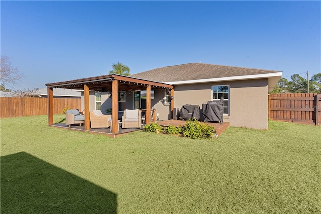 back of property featuring a lawn, a patio area, and an outdoor living space