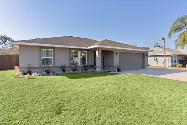 single story home with a garage and a front lawn