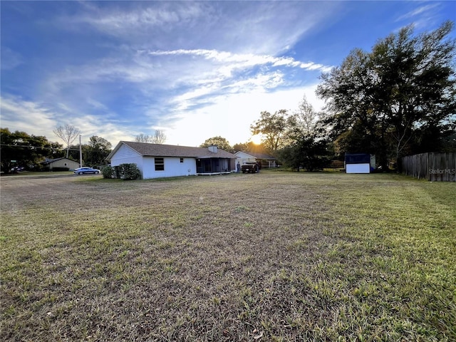 view of yard featuring a storage unit