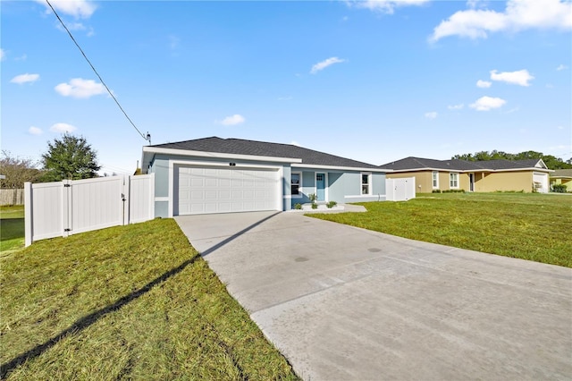 ranch-style house featuring a garage and a front lawn