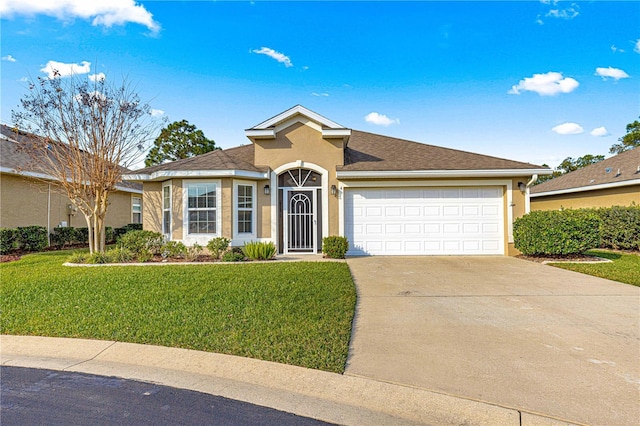 view of front of house with a front lawn and a garage