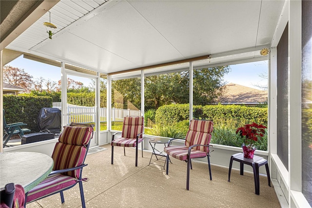 sunroom / solarium featuring a mountain view and a healthy amount of sunlight