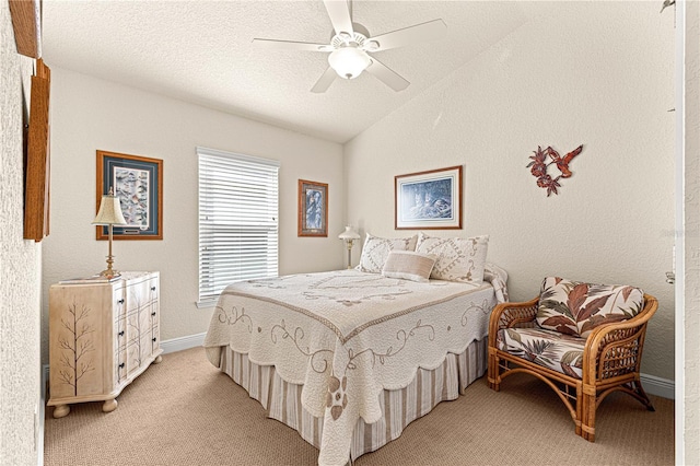 carpeted bedroom with ceiling fan, a textured ceiling, and vaulted ceiling