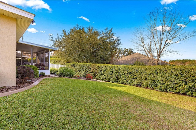 view of yard featuring a sunroom