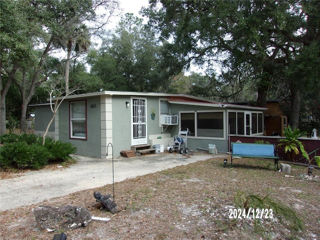 view of front facade with a sunroom