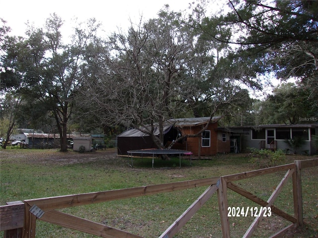 view of yard featuring a trampoline