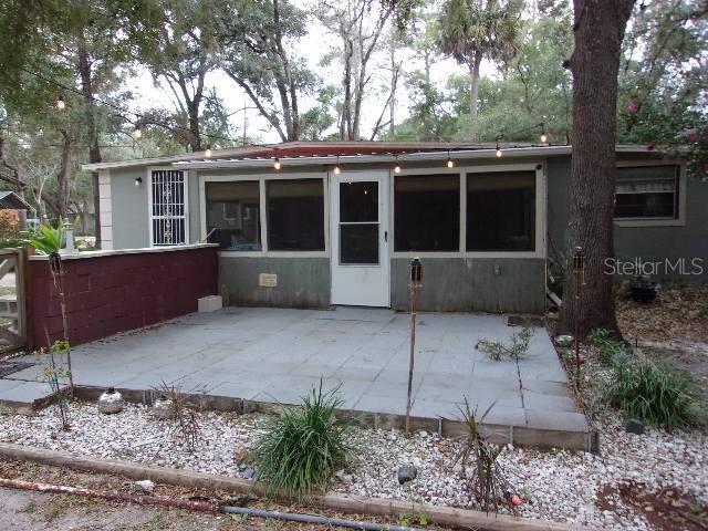 rear view of property with a patio