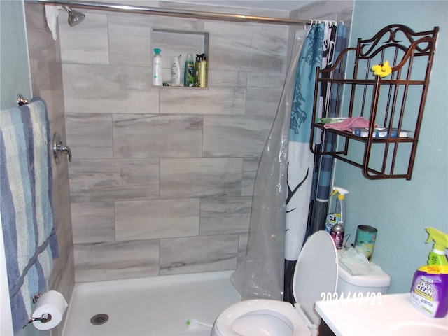 bathroom with walk in shower and toilet