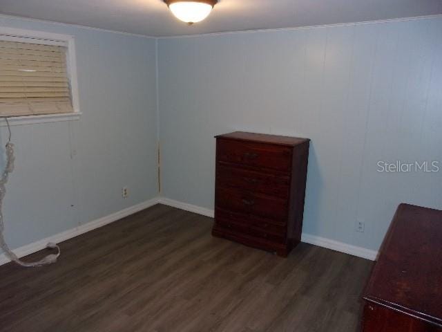 unfurnished bedroom featuring dark hardwood / wood-style floors