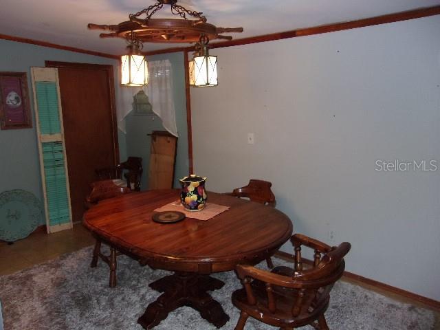 dining room featuring crown molding