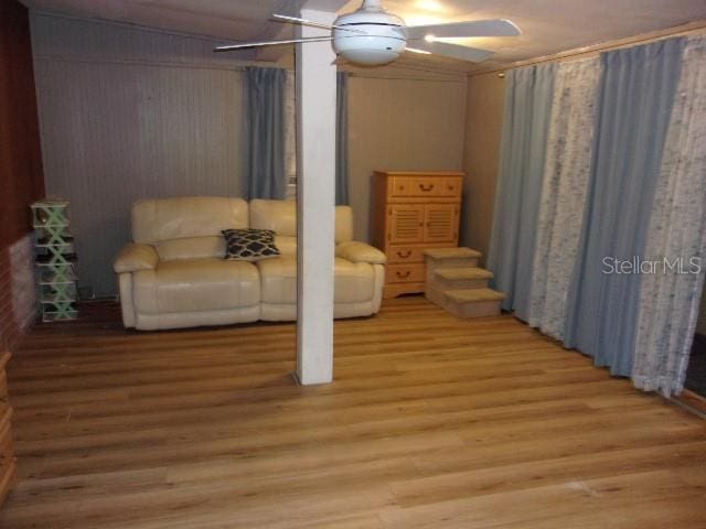 interior space featuring hardwood / wood-style floors and ceiling fan