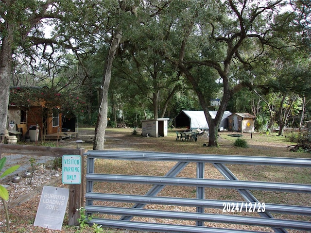 view of home's community with a shed