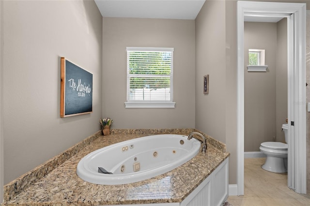 bathroom with a bathing tub and toilet