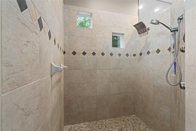 bathroom with tiled shower