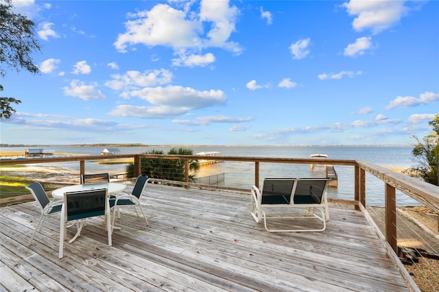 dock area with a deck with water view