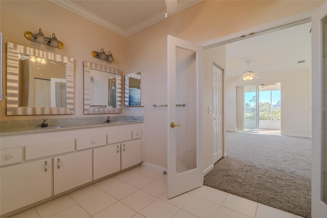 bathroom with tile patterned floors, crown molding, vanity, and ceiling fan