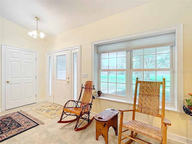 foyer featuring tile patterned floors and a chandelier