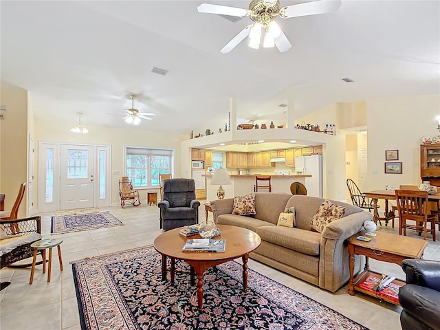 living room with ceiling fan and light tile patterned floors