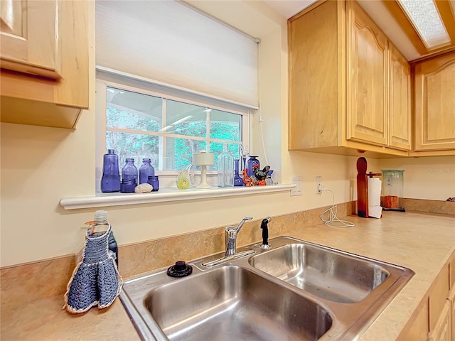 kitchen with sink and light brown cabinets