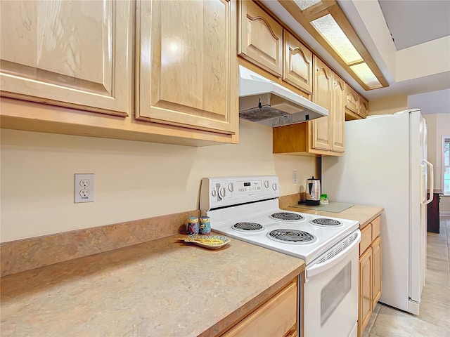 kitchen with light brown cabinets and white electric range oven