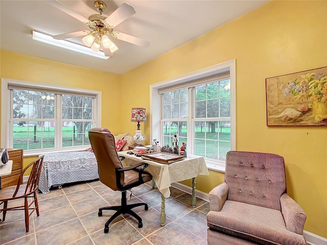 office space with tile patterned floors and ceiling fan